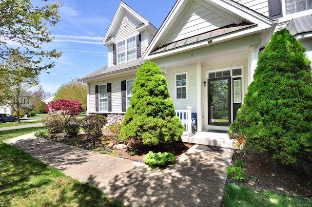 doorway to property featuring a porch