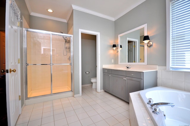 bathroom with vanity, toilet, tile patterned floors, a shower stall, and a bath