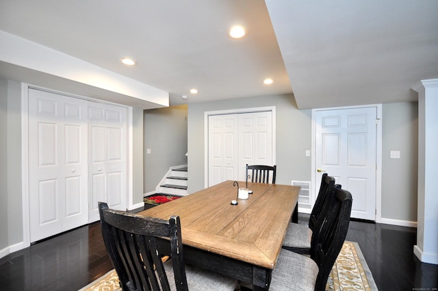 dining area featuring stairs, visible vents, baseboards, dark wood-style floors, and recessed lighting