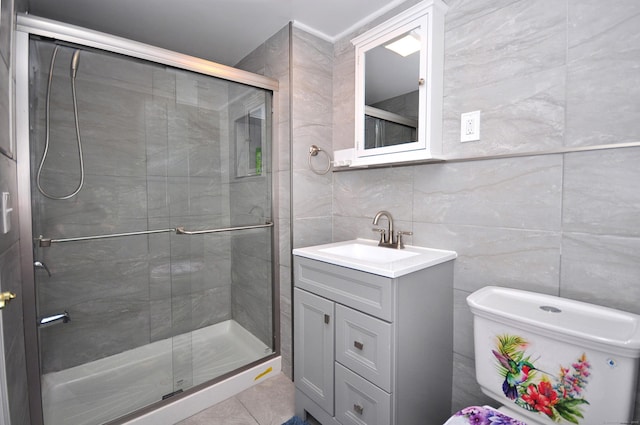bathroom featuring vanity, tile walls, backsplash, and a shower stall