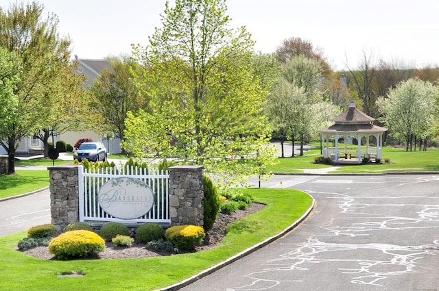 view of home's community with a gazebo and a lawn