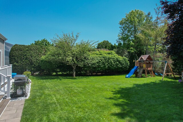 54 Silo Dr, Wethersfield, CT 06109 - view of green lawn with a playground