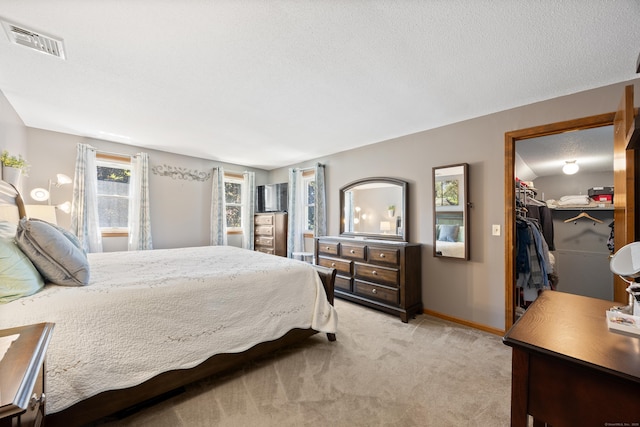 54 Silo Dr, Wethersfield, CT 06109 - bedroom featuring light colored carpet, a spacious closet, baseboards, and a closet