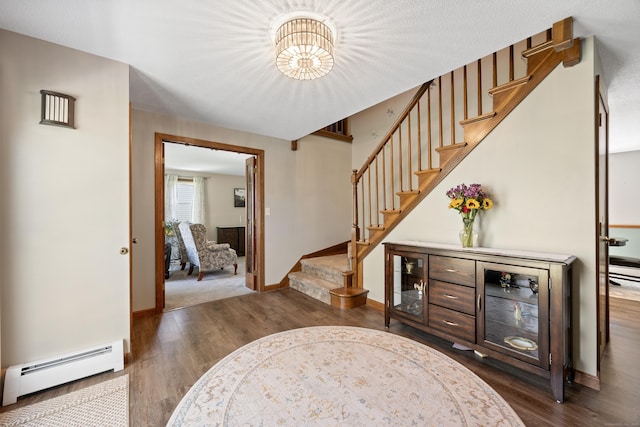 54 Silo Dr, Wethersfield, CT 06109 - entrance foyer featuring baseboard heating, stairs, dark wood-style flooring, and baseboards