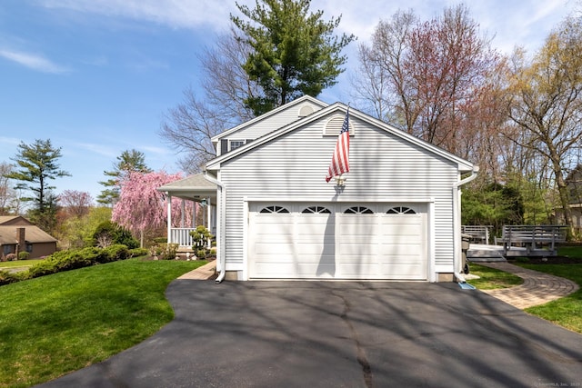 garage with aphalt driveway
