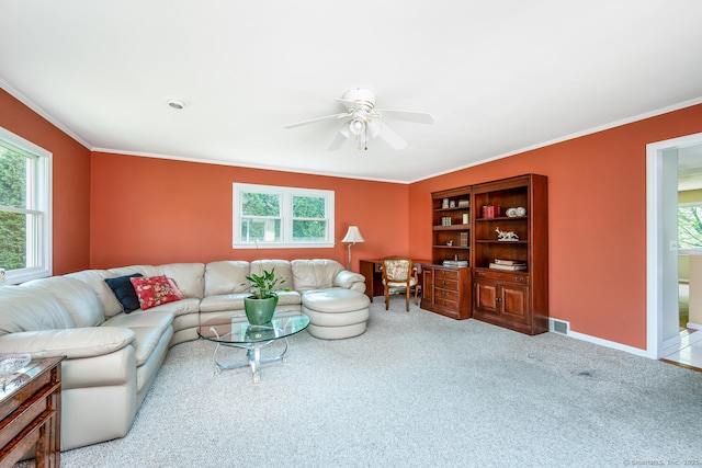 250 Glenn Dr, Stratford, CT 06614 - living area with plenty of natural light, ornamental molding, carpet flooring, a ceiling fan, and baseboards