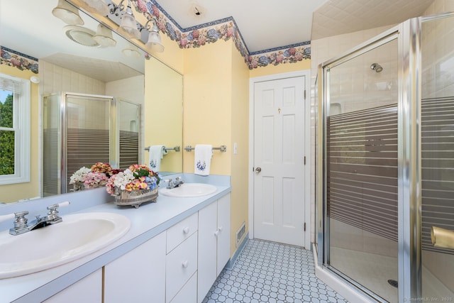 250 Glenn Dr, Stratford, CT 06614 - bathroom featuring double vanity, a shower stall, and tile patterned floors