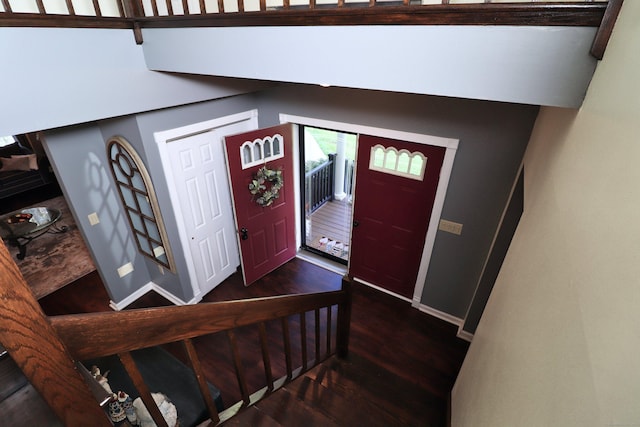 entrance foyer featuring baseboards and wood finished floors