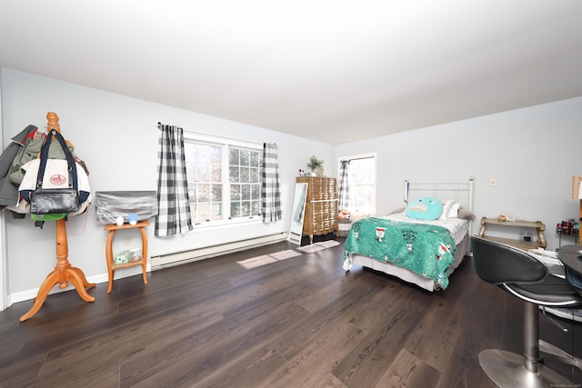 bedroom with a baseboard radiator, wood finished floors, and multiple windows