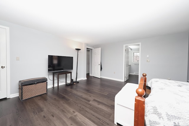 living room featuring baseboards and wood finished floors