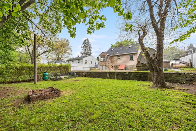view of yard with a fenced backyard