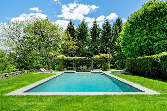 945 Oenoke Rdg, New Canaan, CT 06840 - outdoor pool with a pergola, a lawn, and view of wooded area