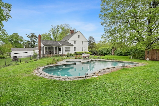 455 E St, Middletown, CT 06457 - rear view of property with a sunroom, a chimney, a pool with connected hot tub, and a shingled roof
