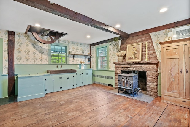 455 E St, Middletown, CT 06457 - bar with wallpapered walls, radiator heating unit, a wood stove, light wood finished floors, and recessed lighting