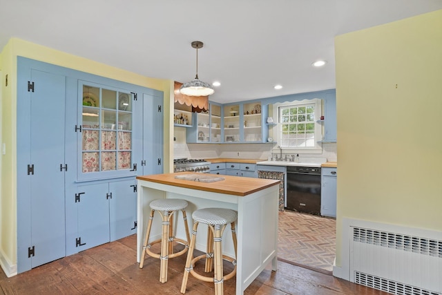 455 E St, Middletown, CT 06457 - kitchen featuring butcher block countertops, dishwasher, radiator, a kitchen breakfast bar, and wood-type flooring