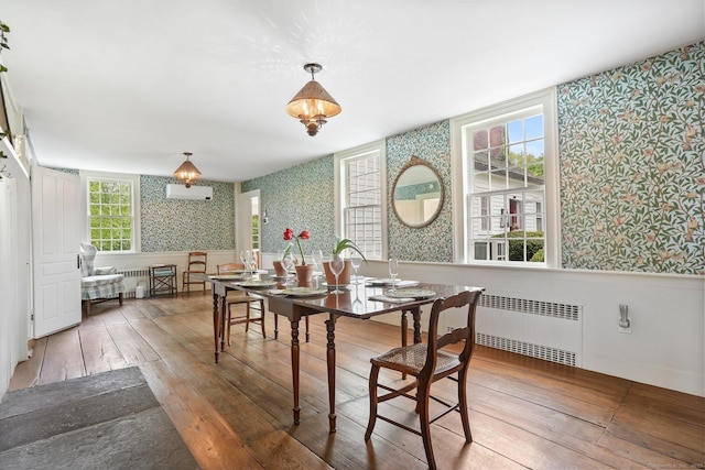 455 E St, Middletown, CT 06457 - dining area with wallpapered walls, radiator heating unit, hardwood / wood-style flooring, and wainscoting