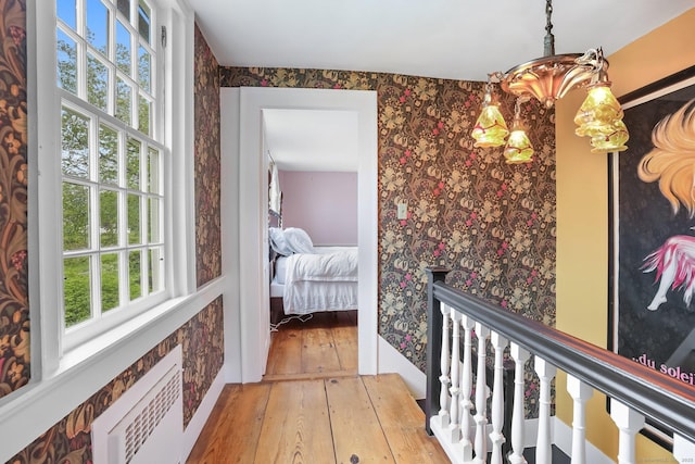 455 E St, Middletown, CT 06457 - corridor with wallpapered walls, hardwood / wood-style floors, an upstairs landing, and an AC wall unit
