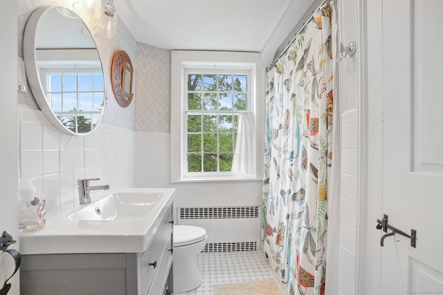 455 E St, Middletown, CT 06457 - bathroom with radiator heating unit, tile walls, toilet, healthy amount of natural light, and vanity