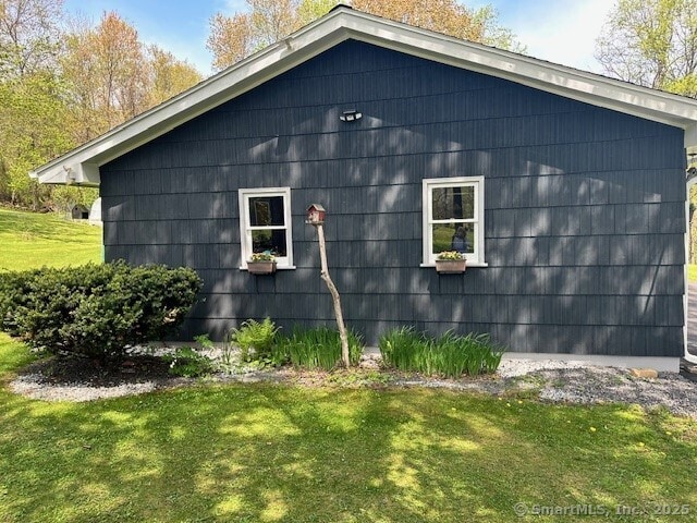 view of property exterior featuring a yard