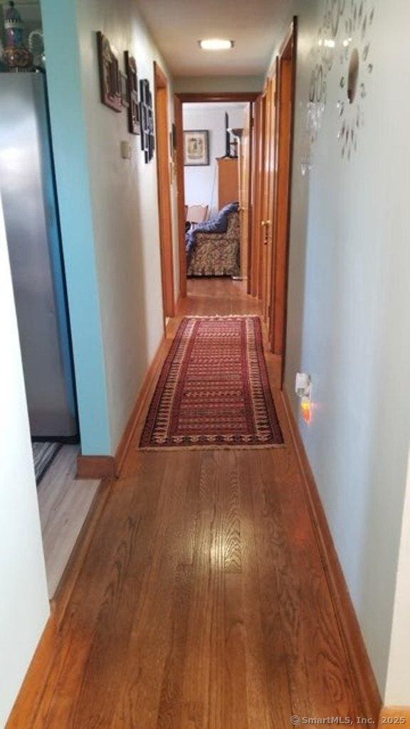 corridor featuring light wood-type flooring