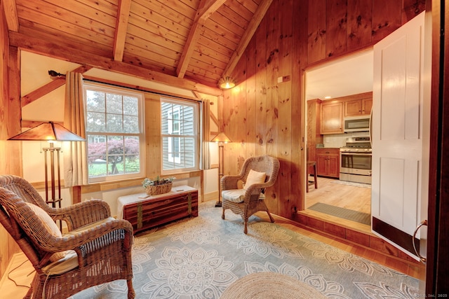 sitting room with wood finished floors, wood ceiling, and wooden walls