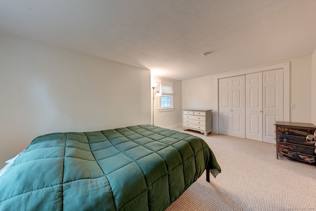 carpeted bedroom with a closet