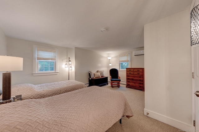 bedroom with a wall unit AC, carpet floors, multiple windows, and baseboards