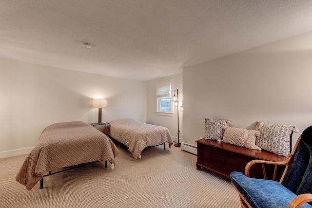 bedroom with carpet, baseboards, and a baseboard radiator