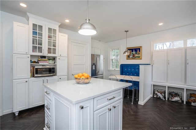 262 Kenyon St, Hartford, CT 06105 - kitchen with stainless steel appliances, white cabinetry, light countertops, glass insert cabinets, and recessed lighting