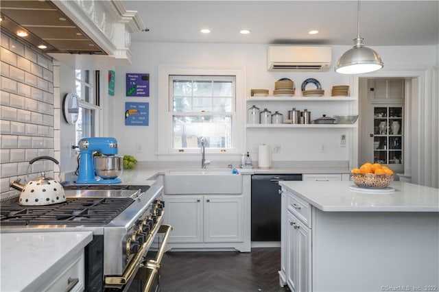 262 Kenyon St, Hartford, CT 06105 - kitchen featuring a sink, a wall unit AC, stainless steel range, pendant lighting, and black dishwasher