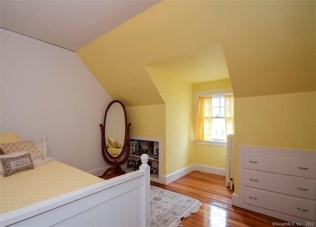 262 Kenyon St, Hartford, CT 06105 - bedroom featuring wood finished floors, vaulted ceiling, and baseboards