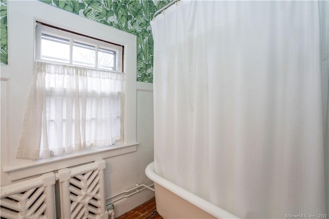 262 Kenyon St, Hartford, CT 06105 - full bath with radiator, a tub to relax in, a shower with shower curtain, and wallpapered walls