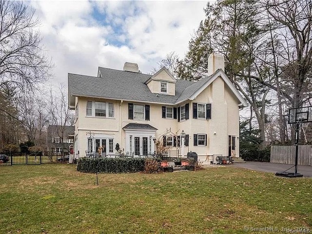 262 Kenyon St, Hartford, CT 06105 - back of house with a chimney, a patio, stucco siding, and entry steps