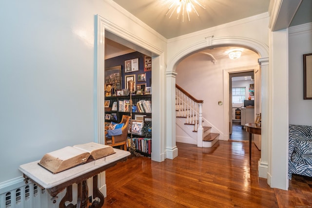 262 Kenyon St, Hartford, CT 06105 - foyer entrance featuring wood finished floors, arched walkways, stairway, ornamental molding, and a chandelier