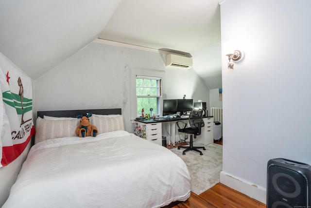 262 Kenyon St, Hartford, CT 06105 - bedroom featuring wood finished floors, vaulted ceiling, a wall mounted AC, and baseboards