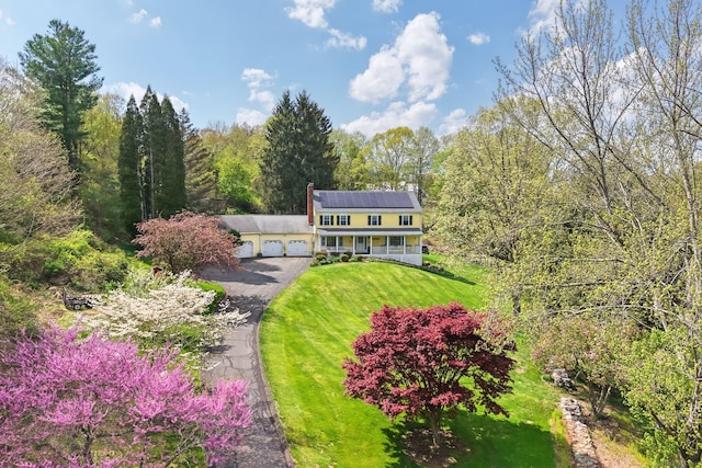 2 White Oak Farm Rd, Newtown, CT 06470 - view of front of property with an attached garage, covered porch, a front lawn, asphalt driveway, and a chimney