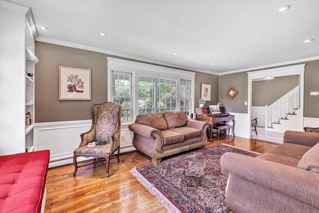 2 White Oak Farm Rd, Newtown, CT 06470 - living area with ornamental molding, wainscoting, stairway, and wood finished floors