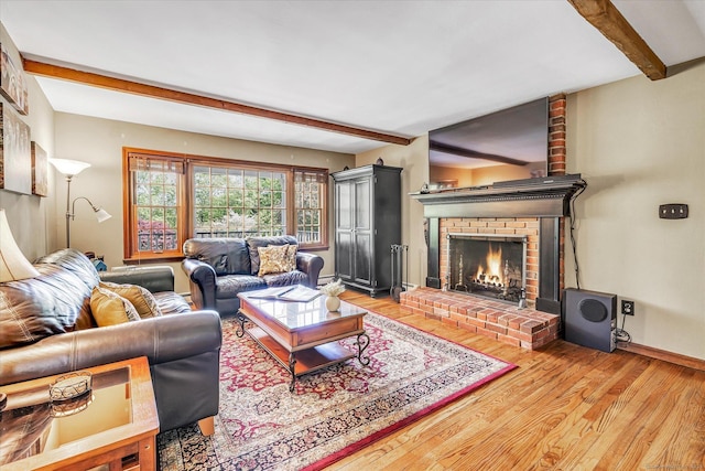 2 White Oak Farm Rd, Newtown, CT 06470 - living area with beam ceiling, light wood-style floors, a brick fireplace, and baseboards