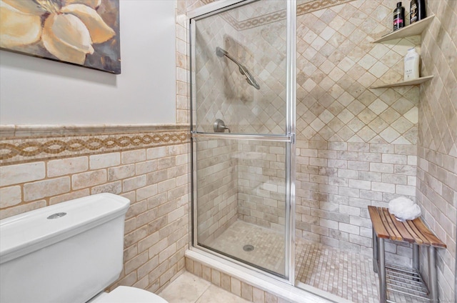 2 White Oak Farm Rd, Newtown, CT 06470 - bathroom featuring a stall shower, toilet, a wainscoted wall, tile walls, and tile patterned flooring