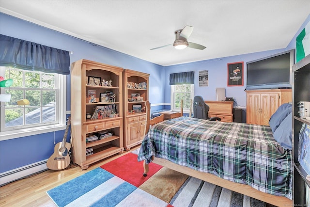 2 White Oak Farm Rd, Newtown, CT 06470 - bedroom featuring wood finished floors, a baseboard heating unit, and a ceiling fan