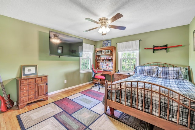 2 White Oak Farm Rd, Newtown, CT 06470 - bedroom with wood finished floors, baseboards, a textured ceiling, and ceiling fan