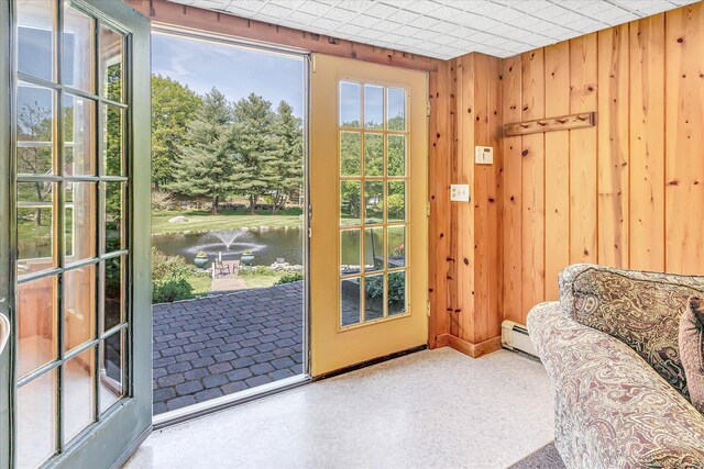 2 White Oak Farm Rd, Newtown, CT 06470 - doorway with a water view, wooden walls, and baseboard heating