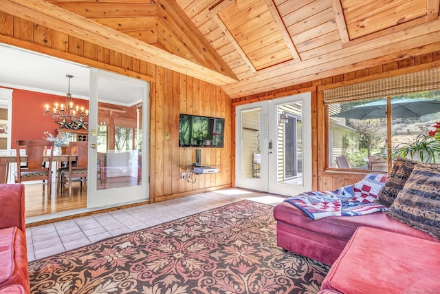 2 White Oak Farm Rd, Newtown, CT 06470 - living area featuring tile patterned floors, a chandelier, healthy amount of natural light, wooden walls, and vaulted ceiling