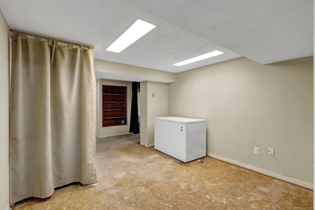 laundry room with baseboards