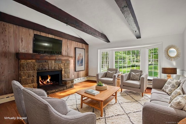 living room featuring light wood-style flooring, a fireplace, lofted ceiling with beams, wooden walls, and a baseboard radiator