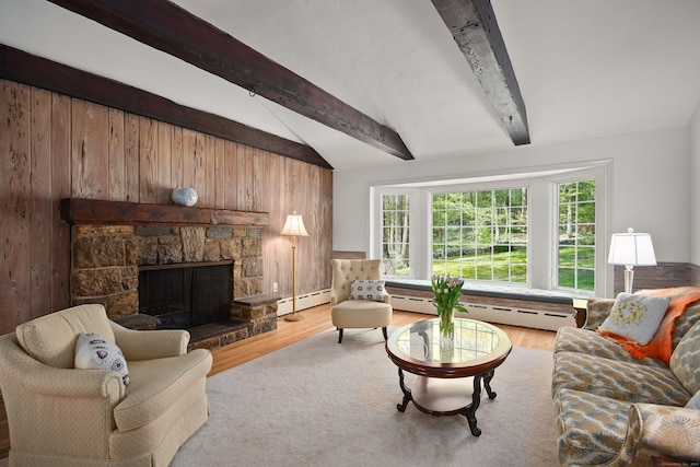 living room featuring a fireplace, wood finished floors, baseboard heating, and vaulted ceiling with beams