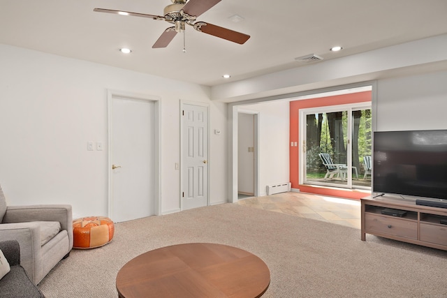 carpeted living room with ceiling fan, visible vents, a baseboard heating unit, and recessed lighting