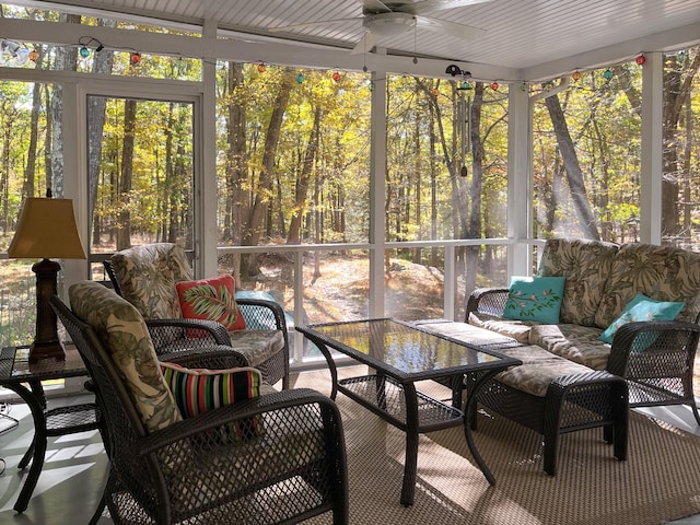 sunroom with a healthy amount of sunlight and ceiling fan