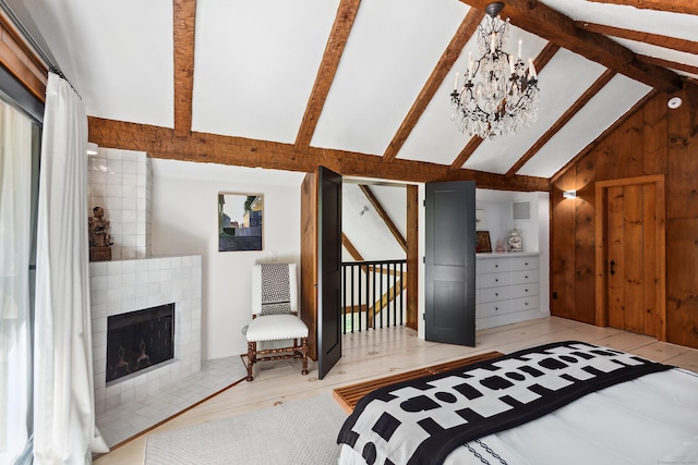 37 Cedar Hls, Weston, CT 06883 - bedroom with a chandelier, a fireplace, and wood finished floors