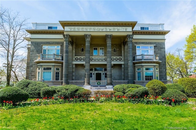 500 Prospect St Apt 1F, New Haven, CT 06511 - view of front facade featuring a balcony, stone siding, covered porch, and a front yard